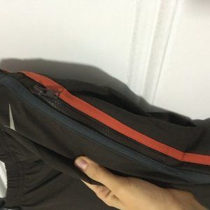 Brown Nike pants; pockets and stripes NWT (small)